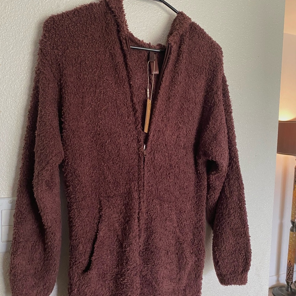 SKIMS COZY KNIT UNISEX ONESIE
Size xxs/xs Kim Kardashian